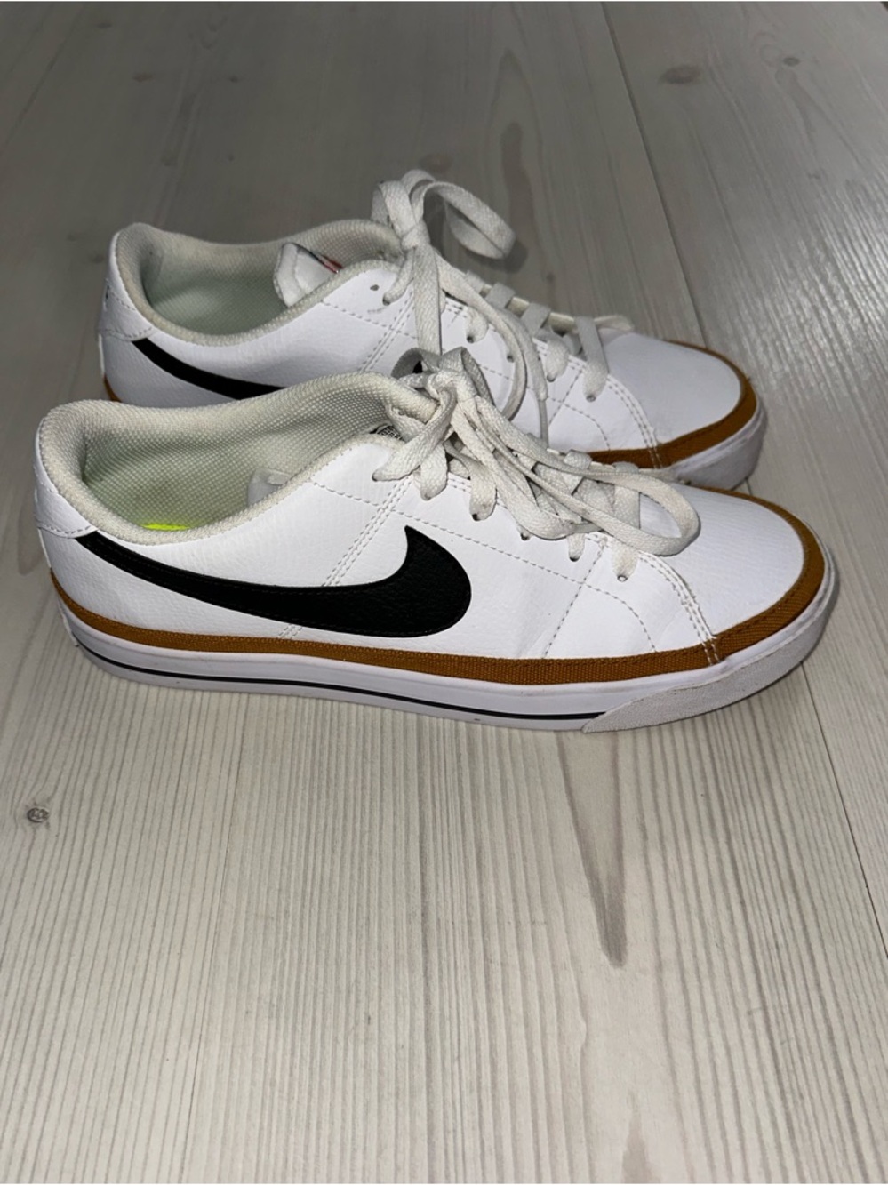 Nike White Low-Top Sneakers with Black Swoosh and Tan Trim